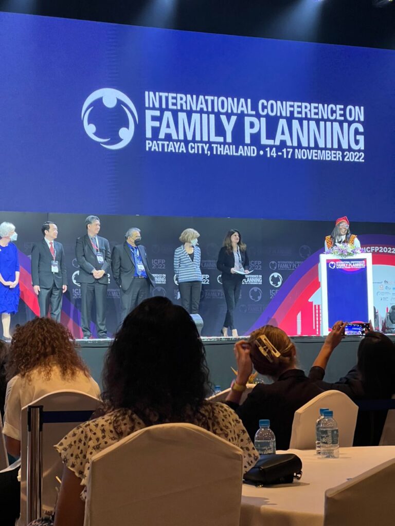 Theresa Power speaking onstage at the 2022 International Conference on Family Planning in Thailand